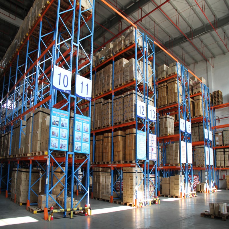 Close-up of heavy-duty powder-coated steel beams and safety locks on selective pallet racks